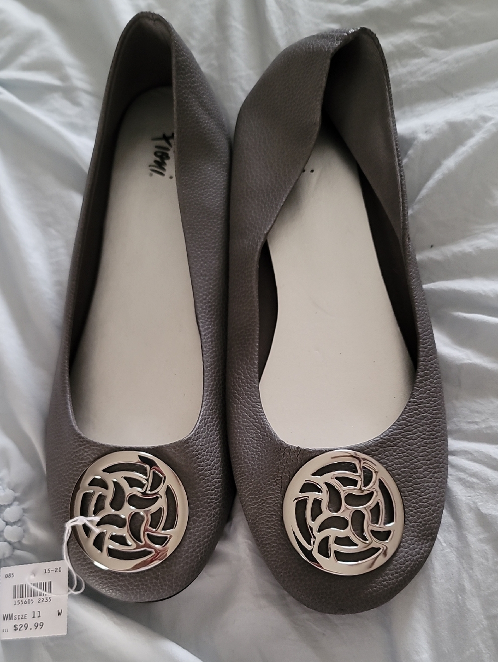 Fioni Taupe-Brown Slip-On Flats with Silver Medallion